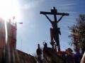 The Christ of the Hiniesta fraternity, seen against the light, on the Alameda de Hércules.