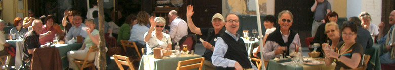 People enjoying the sun on a terrace in Seville.